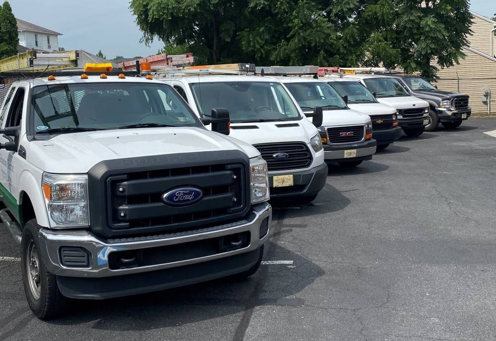 A truck with a backhoe attached on the back